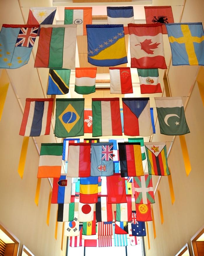 Country flags hanging in a hallway on Mount Union's campus.